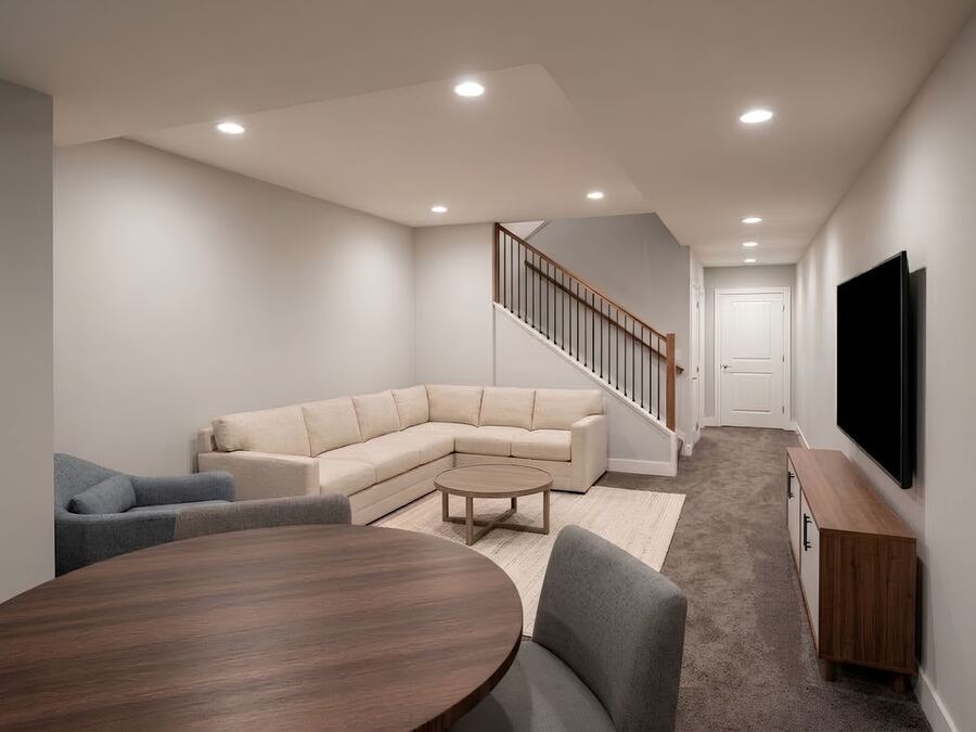 Rendering of the lower-level family room and stair